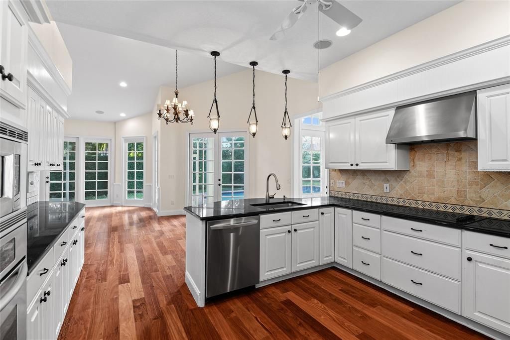 Chandelier, Interior, Kitchen, Pendant Lights, Recessed Lighting, Stainless Steel Appliances, Wood Texture Flooring