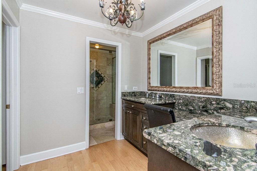 Bathroom, Chandelier, Dual Sink Vanities, Interior, Wood Texture Flooring