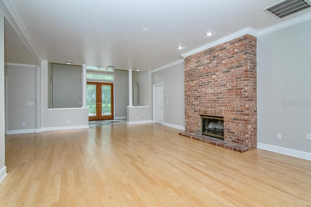 Empty room, Fireplace, Interior, Recessed Lighting, Stone Walls, Wood Texture Flooring