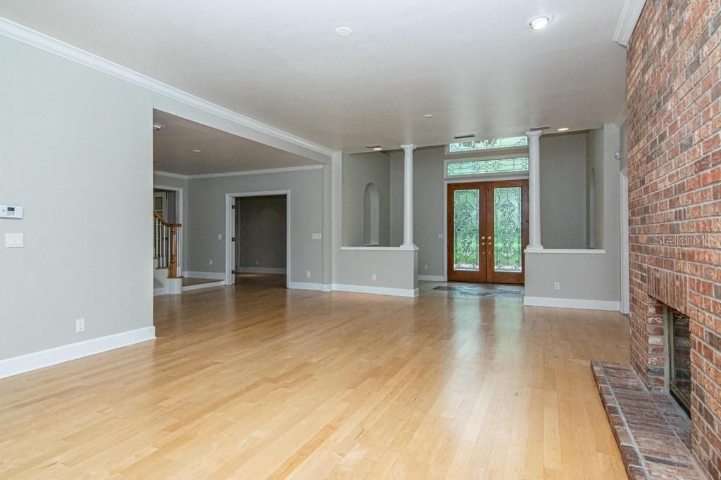Empty room, Fireplace, Interior, Recessed Lighting, Stone Walls, Wood Texture Flooring