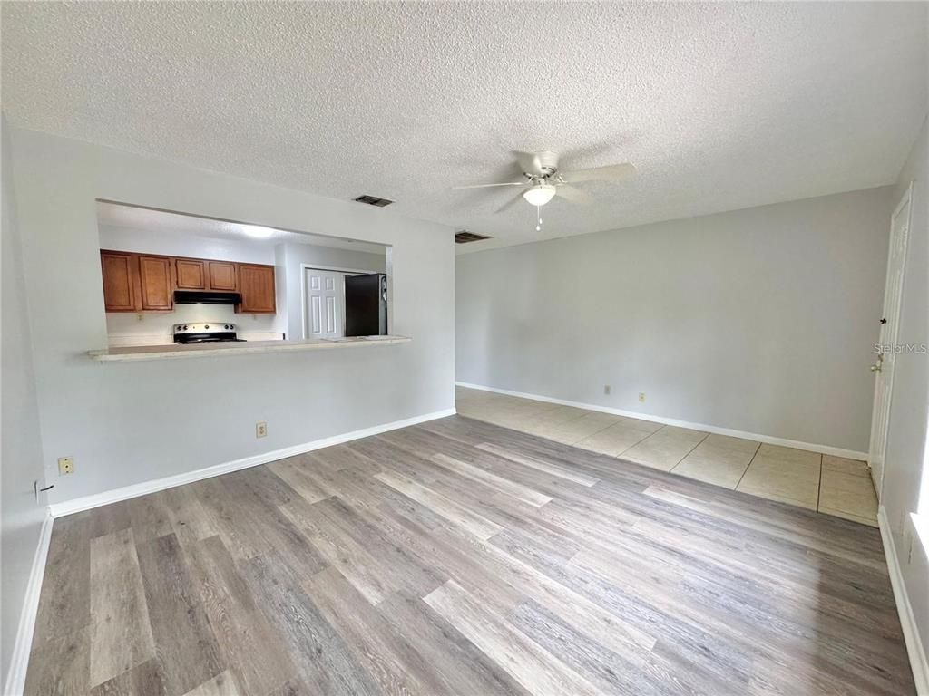 Empty room, Interior, Kitchen, Stainless Steel Appliances, Wood Texture Flooring