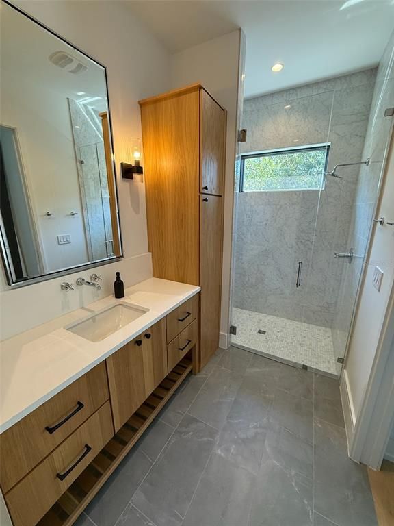 Bathroom, Dual Sink Vanities, Glass Shower, Interior, Marble Walls, Recessed Lighting