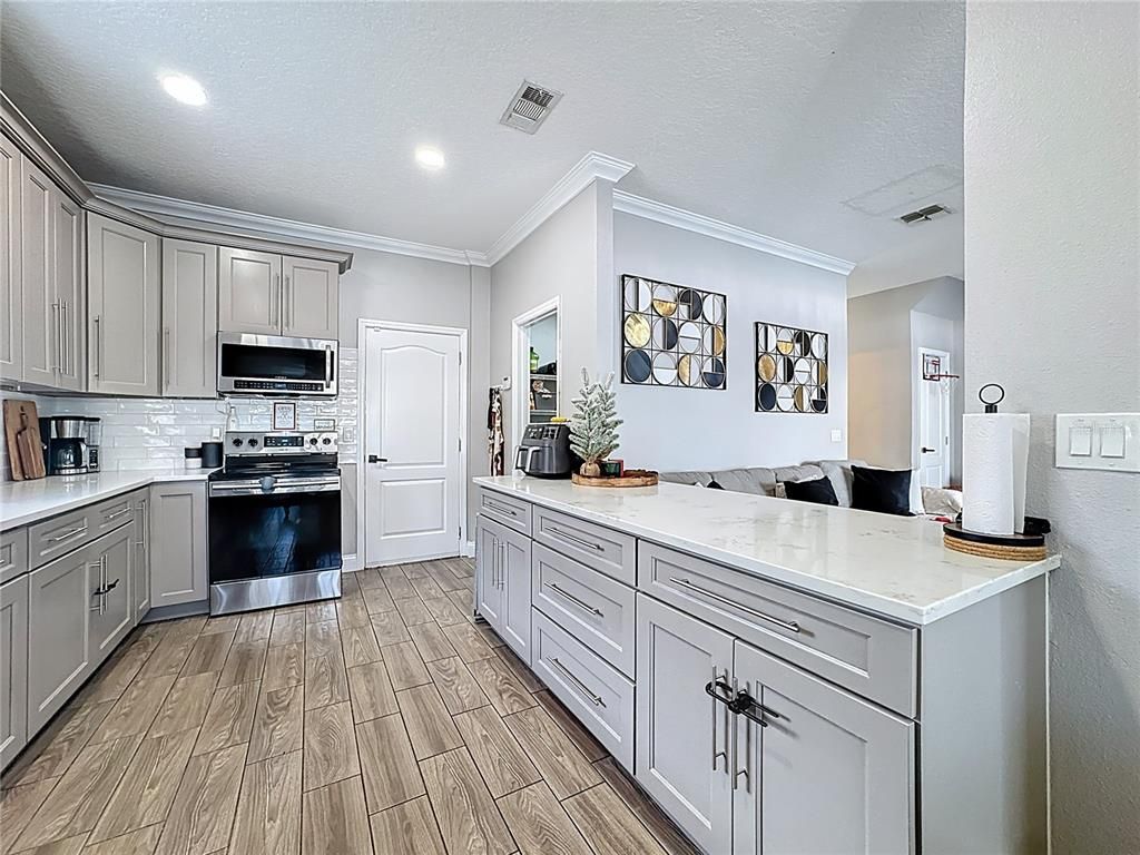 Interior, Kitchen, Recessed Lighting, Stainless Steel Appliances, Wood Texture Flooring