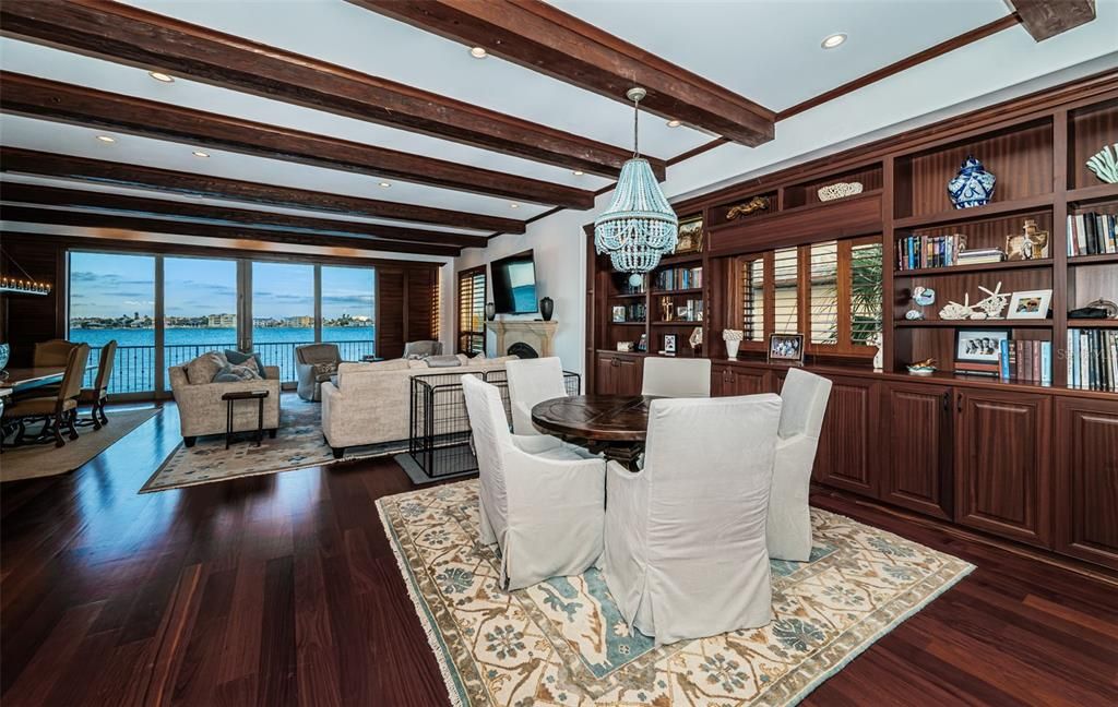 Chandelier, Dining room, Fireplace, Interior, Living room, Pendant Lights, Recessed Lighting, Water, Wooden Beams, Wood Texture Flooring