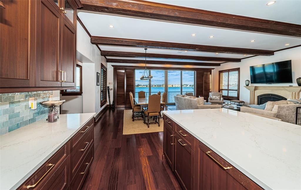 Dining room, Fireplace, Interior, Kitchen, Living room, Pendant Lights, Recessed Lighting, Water, Wooden Beams, Wood Texture Flooring