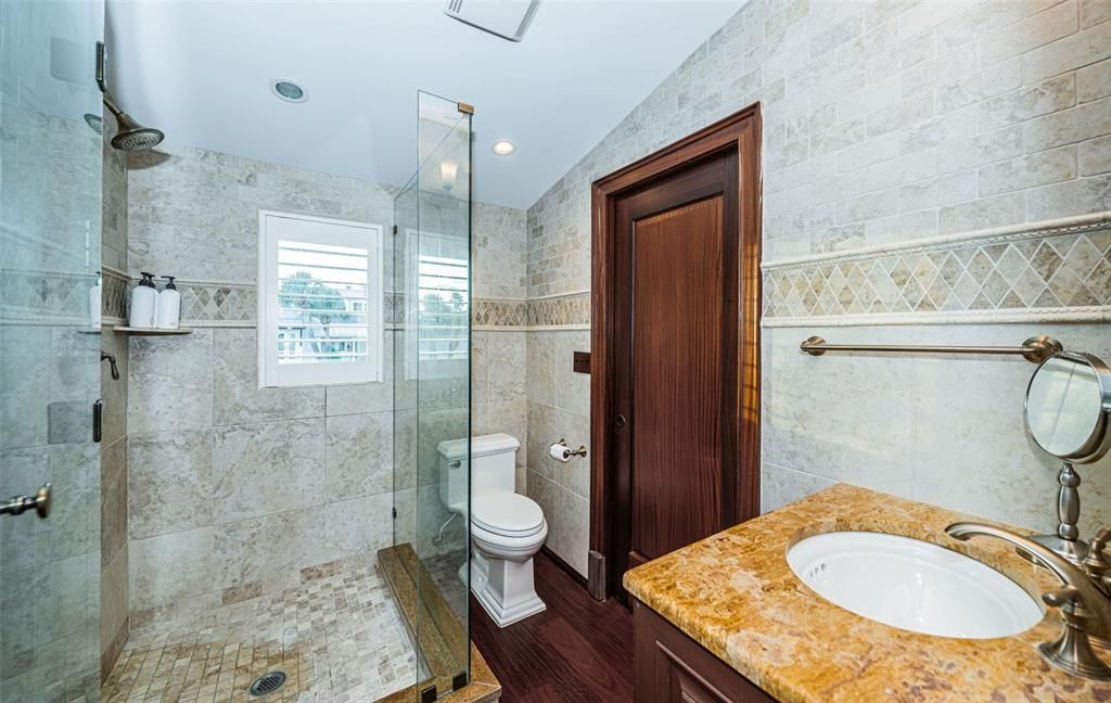 Bathroom, Glass Shower, Interior, Recessed Lighting, Stone Walls, Wood Texture Flooring