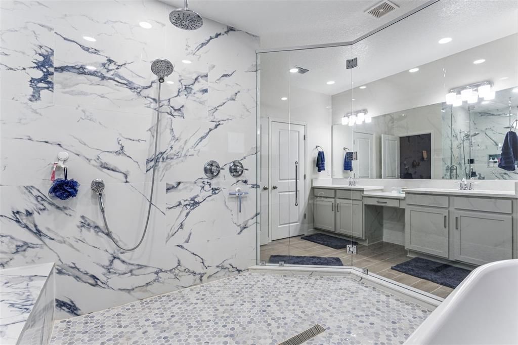 Bathroom, Dual Sink Vanities, Free Standing Baths, Glass Shower, Interior, Marble Walls, Recessed Lighting