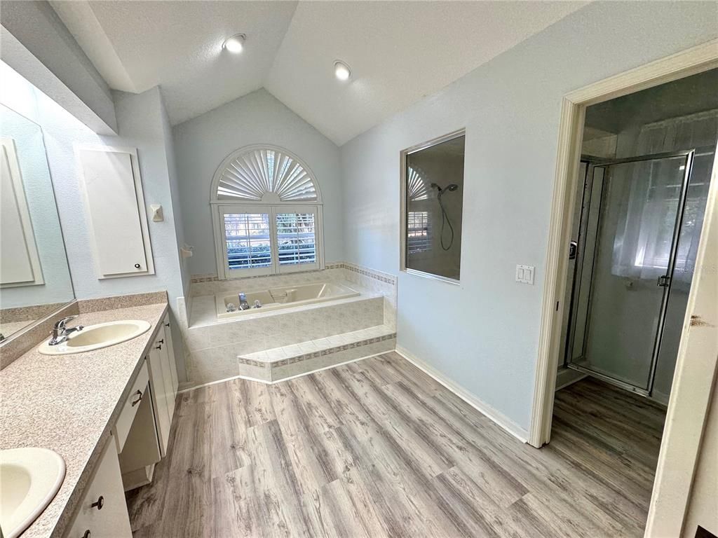 Bathroom, Dual Sink Vanities, Glass Shower, Interior, Recessed Lighting, Wood Texture Flooring