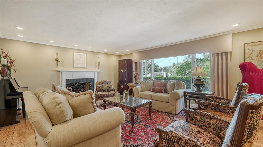 Fireplace, Interior, Living room, Piano, Recessed Lighting, Wood Texture Flooring