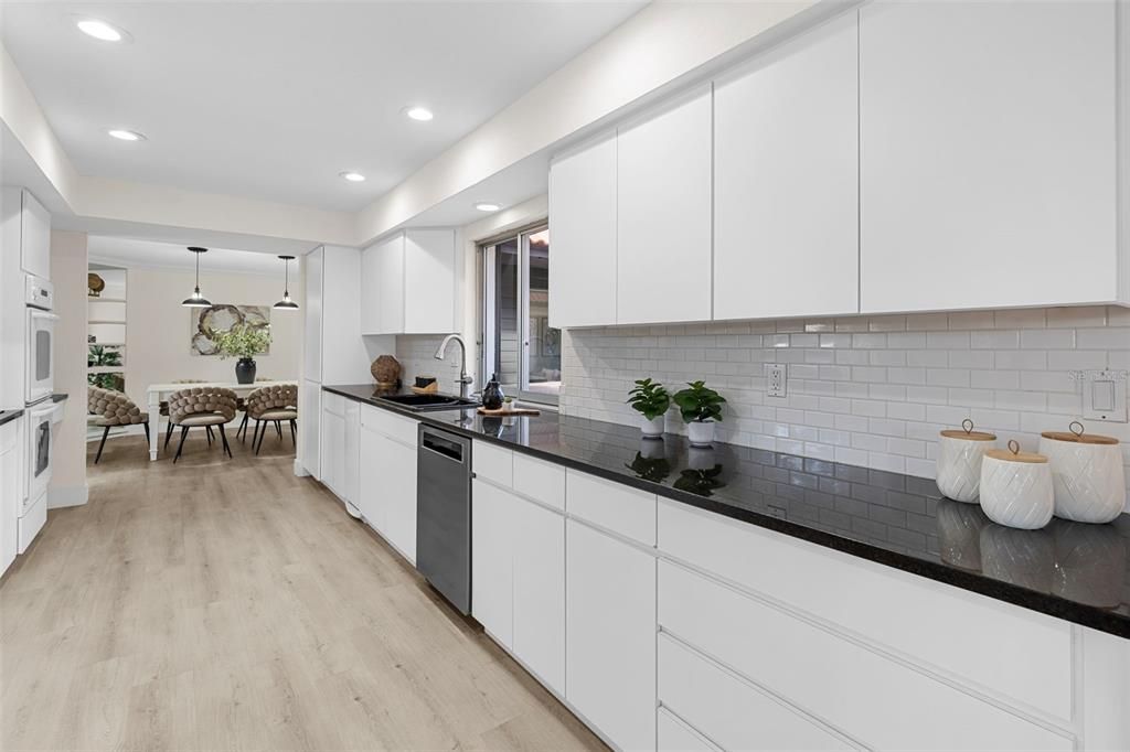Dining room, Interior, Kitchen, Pendant Lights, Recessed Lighting, Stainless Steel Appliances, Wood Texture Flooring