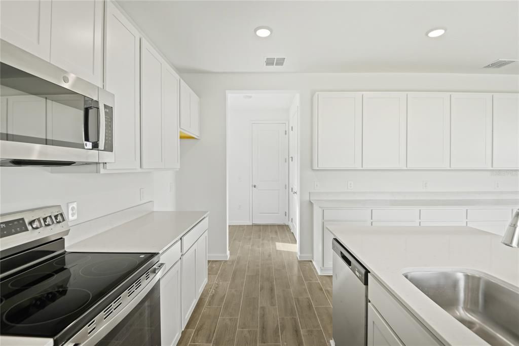 Interior, Kitchen, Recessed Lighting, Stainless Steel Appliances, Wood Texture Flooring