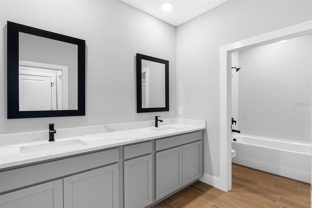 Bathroom, Dual Sink Vanities, Interior, Recessed Lighting, Wood Texture Flooring