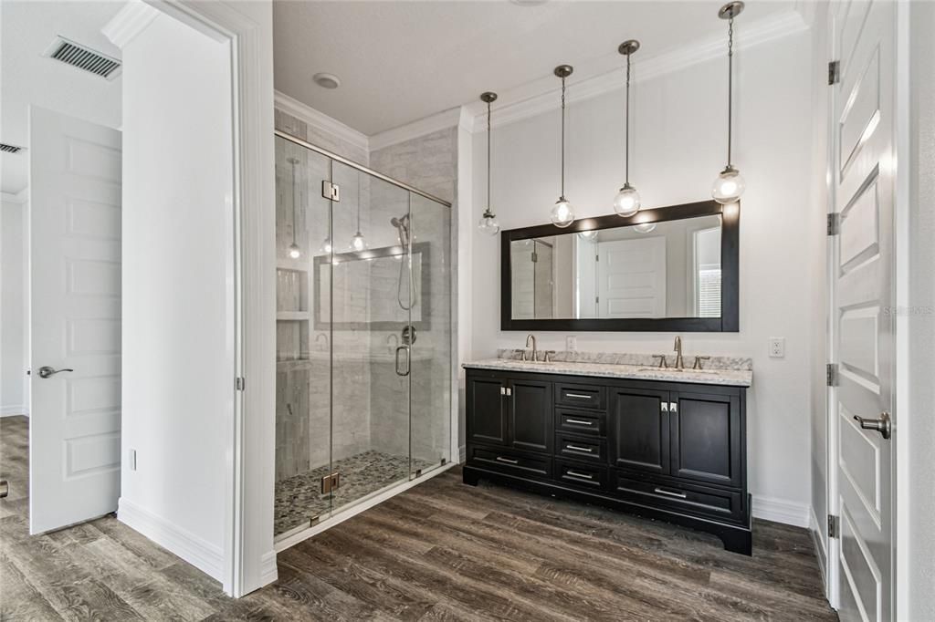 Bathroom, Dual Sink Vanities, Glass Shower, Interior, Pendant Lights, Wood Texture Flooring