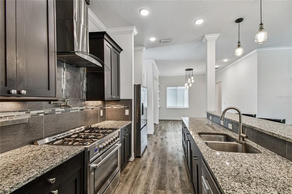 Chandelier, Interior, Kitchen, Pendant Lights, Recessed Lighting, Stainless Steel Appliances, Wood Texture Flooring