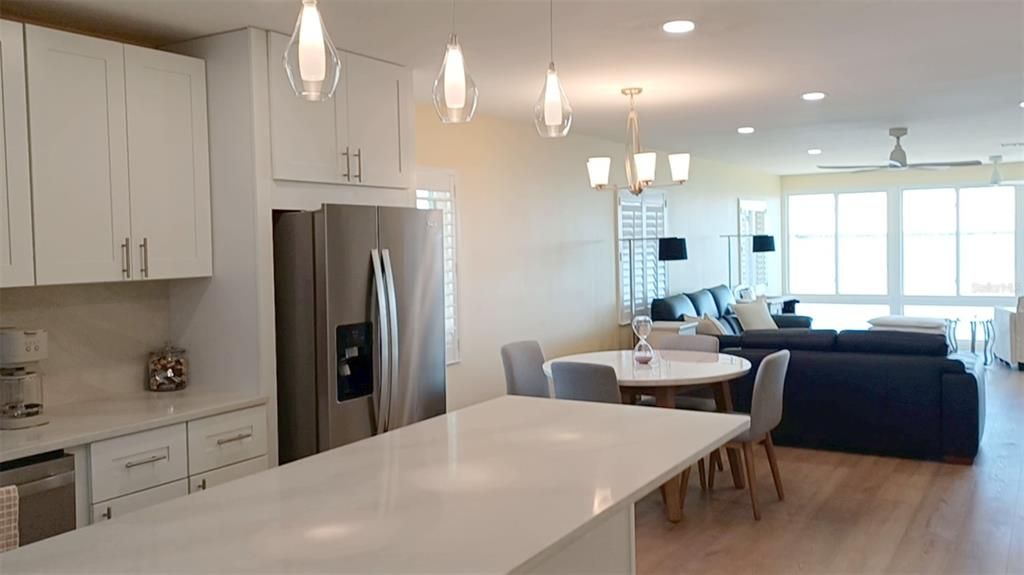 Dining room, Interior, Kitchen, Living room, Pendant Lights, Recessed Lighting, Stainless Steel Appliances, Wood Texture Flooring