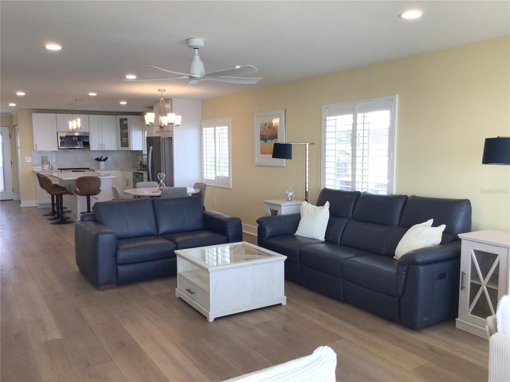 Chandelier, Dining room, Interior, Kitchen, Living room, Recessed Lighting, Stainless Steel Appliances, Wood Texture Flooring