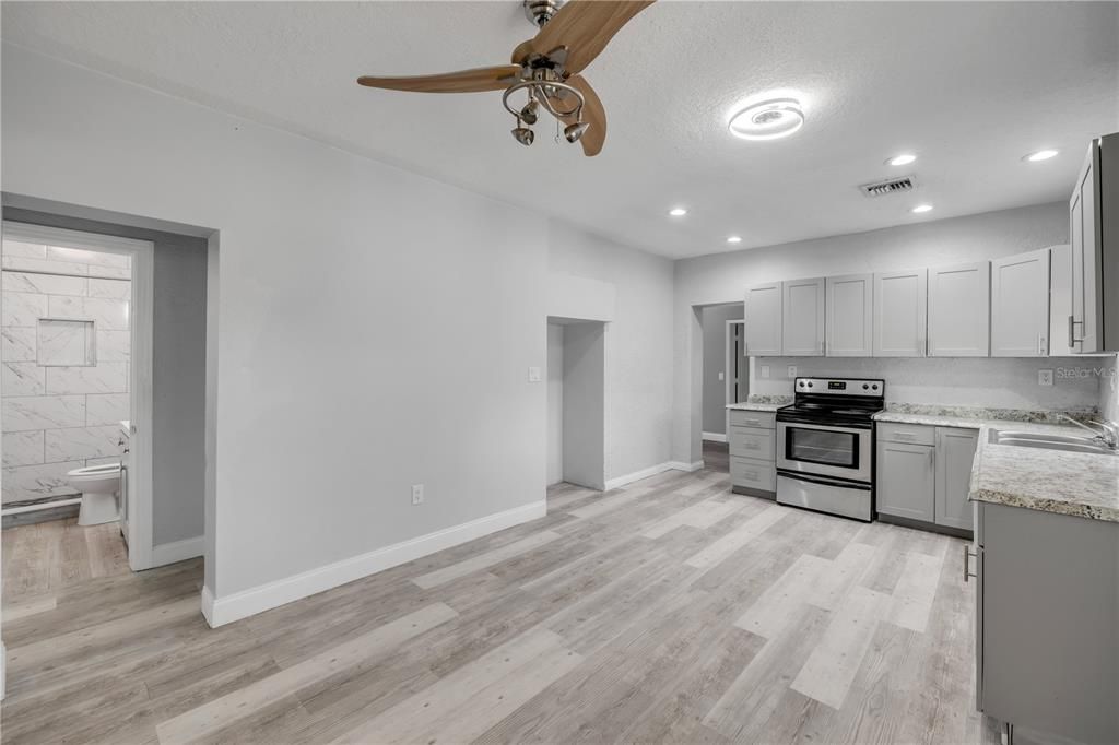 Interior, Kitchen, Recessed Lighting, Stainless Steel Appliances, Wood Texture Flooring
