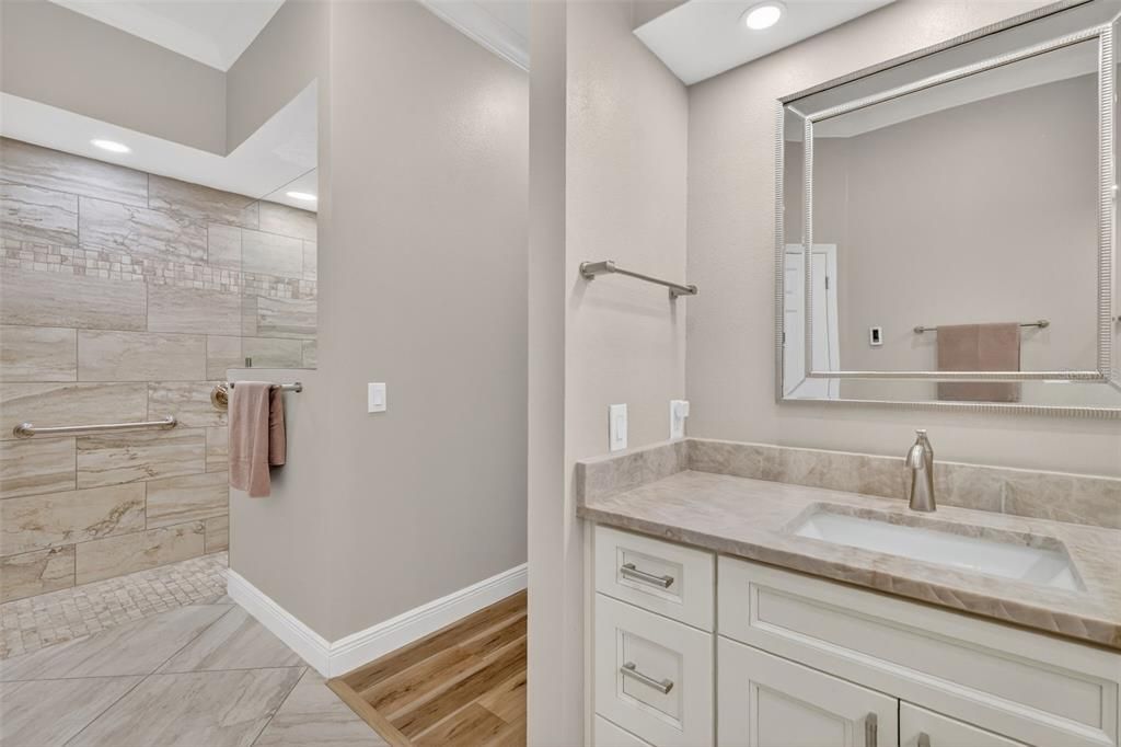 Bathroom, Dual Sink Vanities, Interior, Recessed Lighting, Wood Texture Flooring