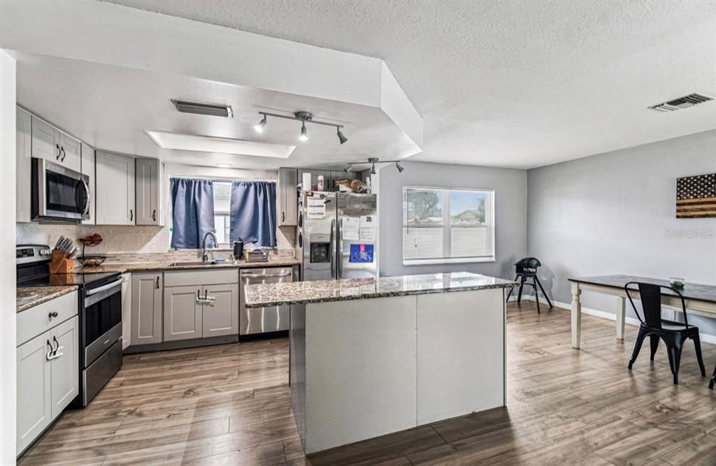 Dining room, Interior, Kitchen, Stainless Steel Appliances, Wood Texture Flooring