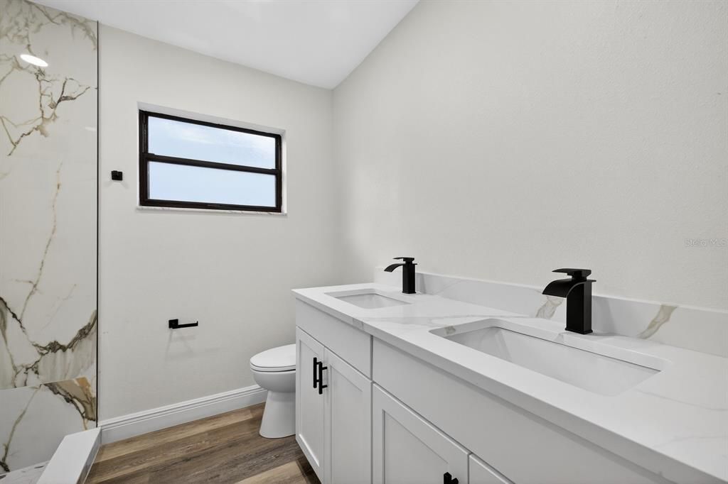 Bathroom, Dual Sink Vanities, Interior, Marble Walls, Wood Texture Flooring