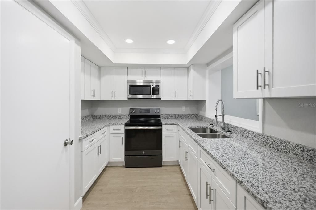 Interior, Kitchen, Recessed Lighting, Stainless Steel Appliances, Wood Texture Flooring