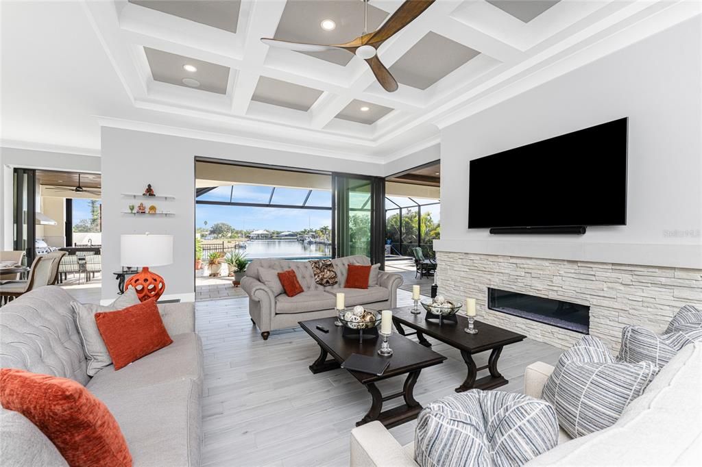 Fireplace, Interior, Living room, Recessed Lighting, Water, Wood Texture Flooring