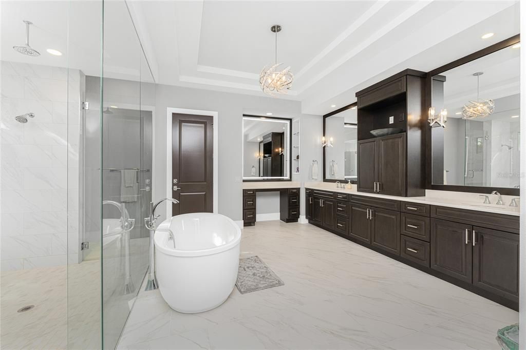 Bathroom, Chandelier, Dual Sink Vanities, Free Standing Baths, Glass Shower, Interior, Marble, Marble Walls, Pendant Lights, Recessed Lighting