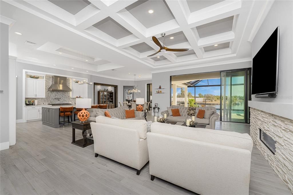 Dining room, Fireplace, Interior, Kitchen, Living room, Pendant Lights, Recessed Lighting, Stainless Steel Appliances, Wood Texture Flooring