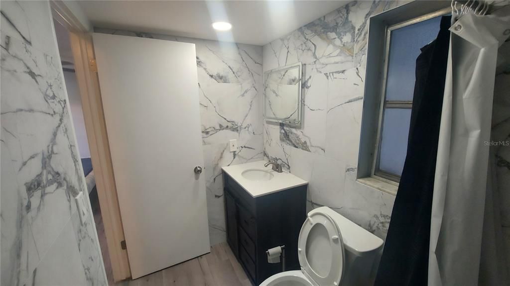 Bathroom, Interior, Marble Walls, Recessed Lighting, Wood Texture Flooring