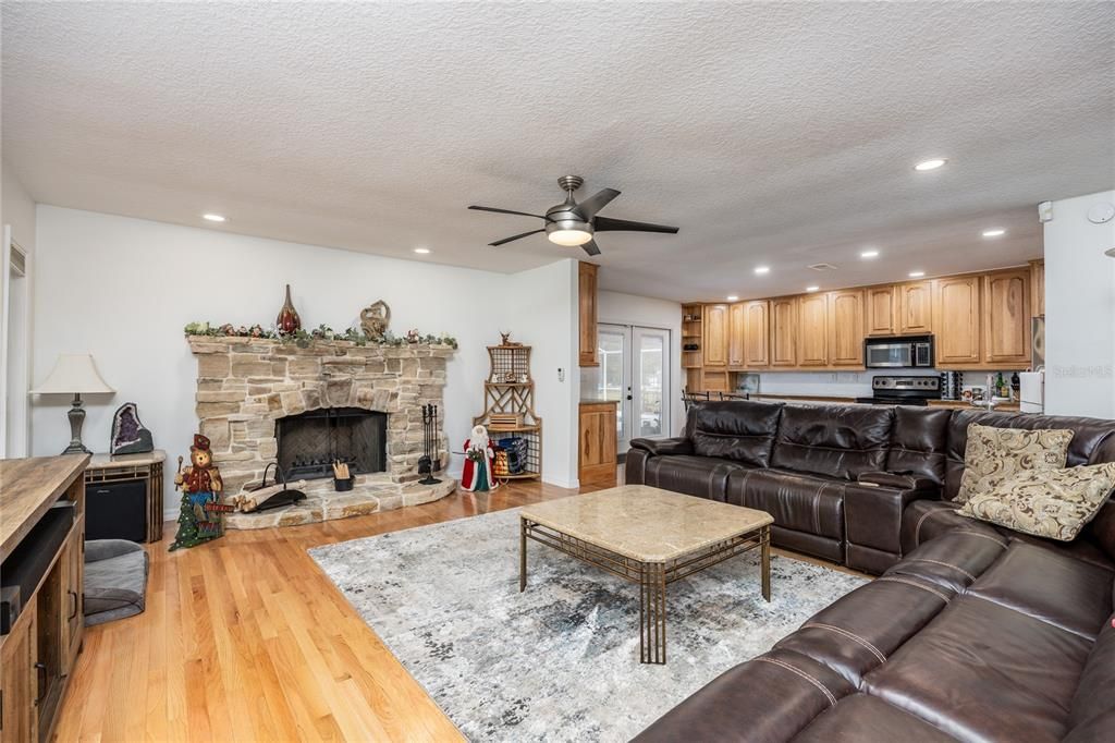 Fireplace, Interior, Kitchen, Living room, Recessed Lighting, Wood Texture Flooring