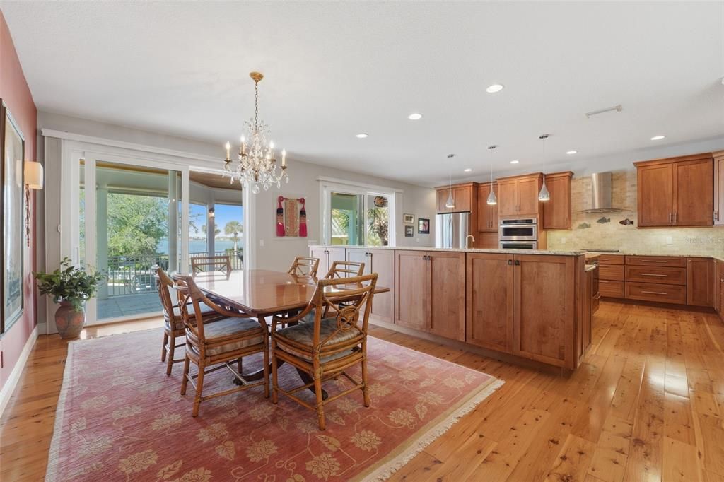 Chandelier, Dining room, Interior, Kitchen, Pendant Lights, Recessed Lighting, Stainless Steel Appliances, Wood Texture Flooring