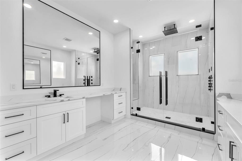 Bathroom, Dual Sink Vanities, Glass Shower, Interior, Marble, Marble Walls, Recessed Lighting