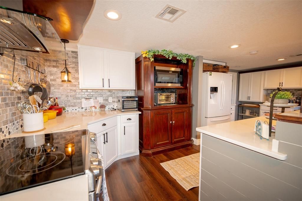 Interior, Kitchen, Pendant Lights, Recessed Lighting, Stainless Steel Appliances, Stone Walls, Wood Texture Flooring