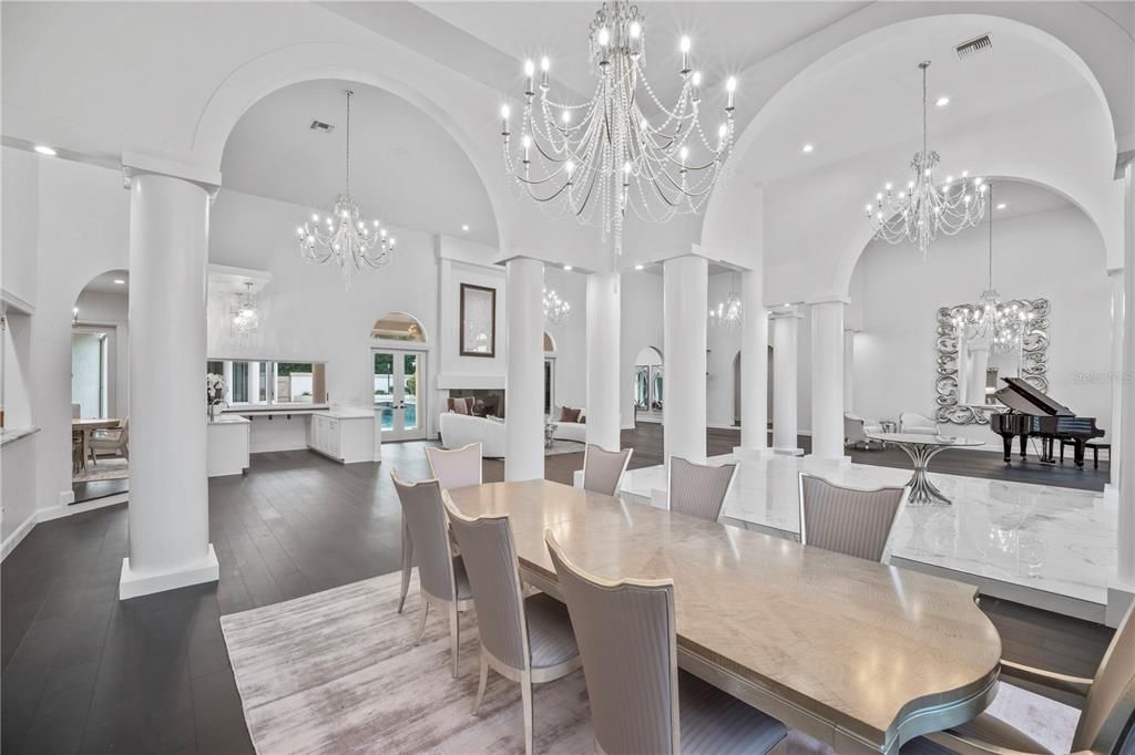 Chandelier, Dining room, Fireplace, Interior, Pendant Lights, Piano, Recessed Lighting, Wood Texture Flooring