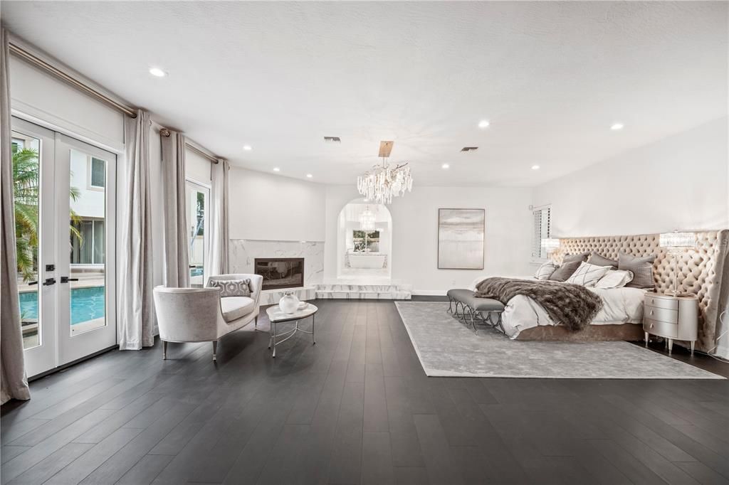Bedroom, Chandelier, Fireplace, Interior, Recessed Lighting, Wood Texture Flooring