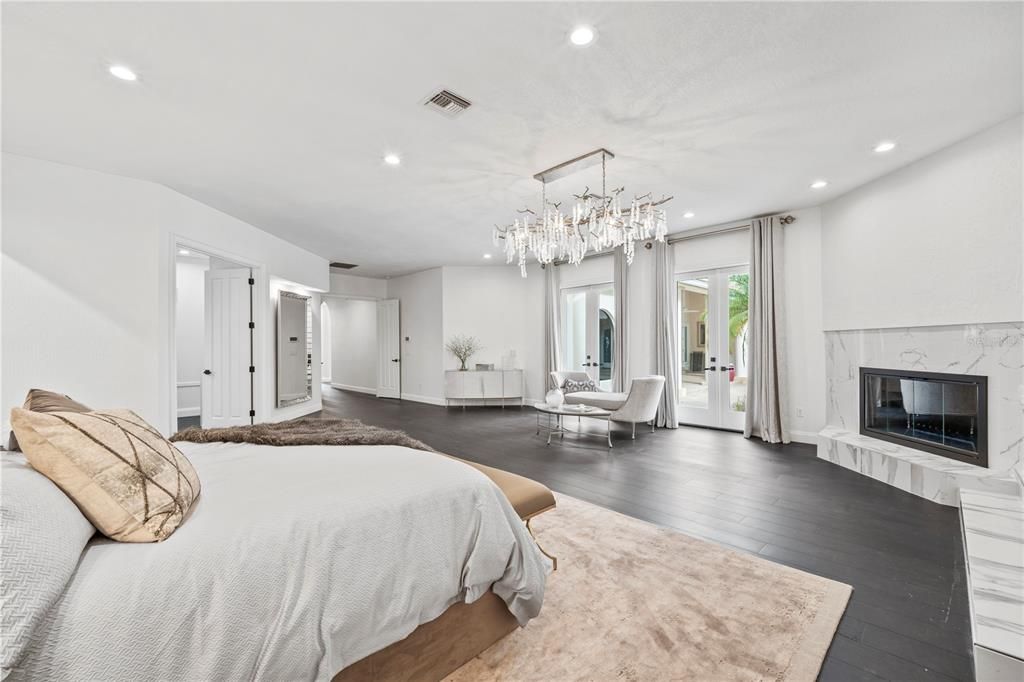 Bedroom, Chandelier, Fireplace, Interior, Recessed Lighting, Wood Texture Flooring