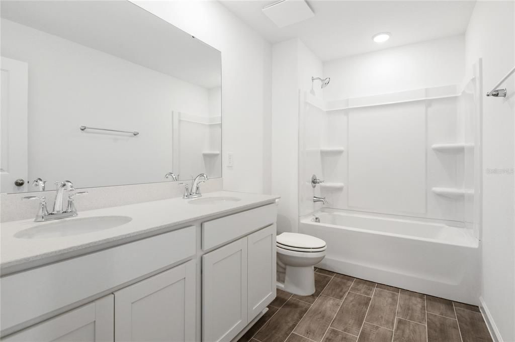 Bathroom, Dual Sink Vanities, Interior, Recessed Lighting, Wood Texture Flooring