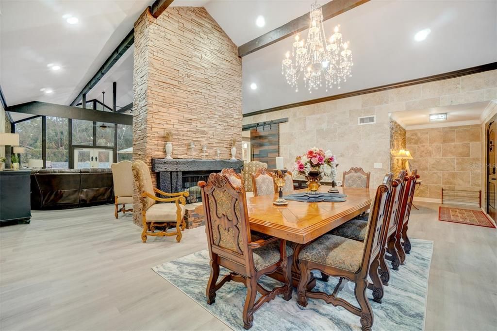 Chandelier, Dining room, Fireplace, Interior, Recessed Lighting, Stone Walls, Wood Texture Flooring