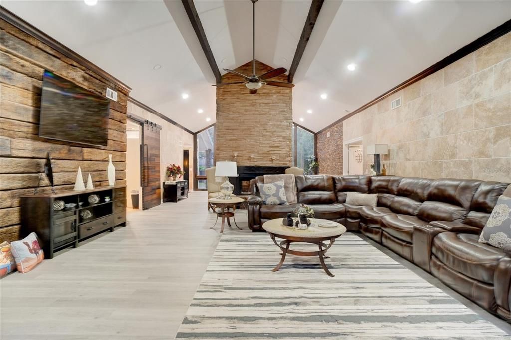 Fireplace, Interior, Living room, Recessed Lighting, Stone Walls, Wood Texture Flooring, Wooden Walls