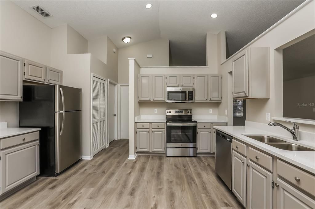 Interior, Kitchen, Recessed Lighting, Stainless Steel Appliances, Wood Texture Flooring
