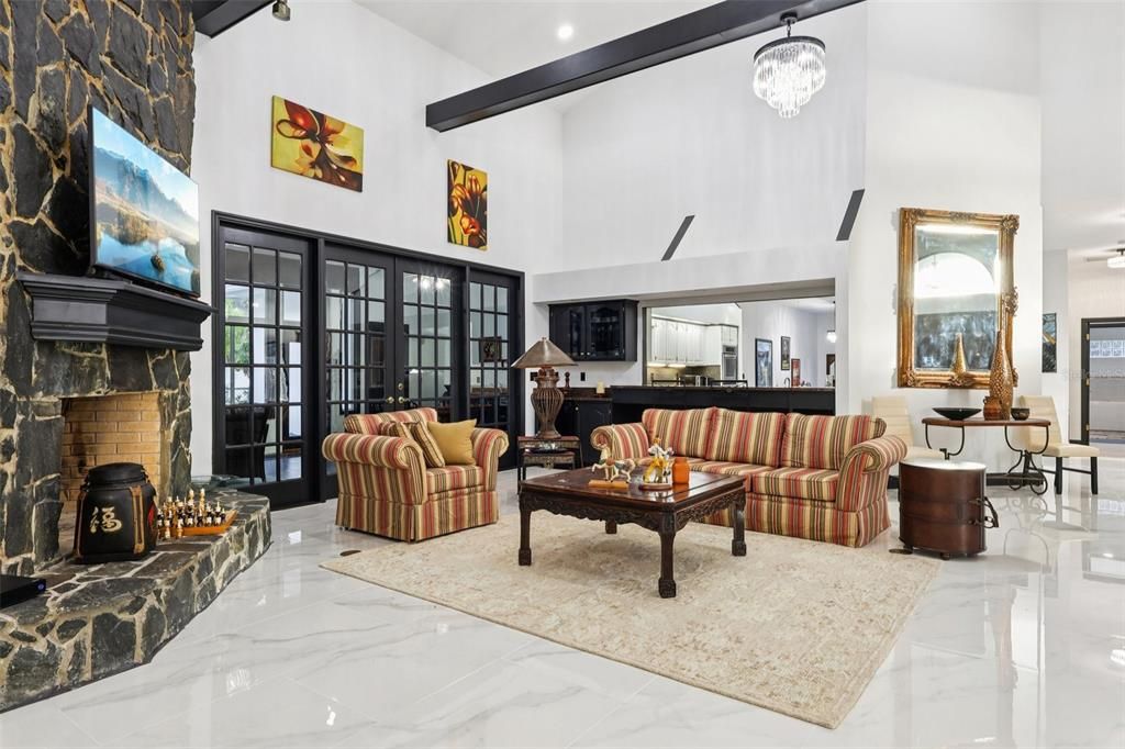 Chandelier, Dining room, Fireplace, Interior, Living room, Marble, Pendant Lights, Recessed Lighting, Wooden Beams