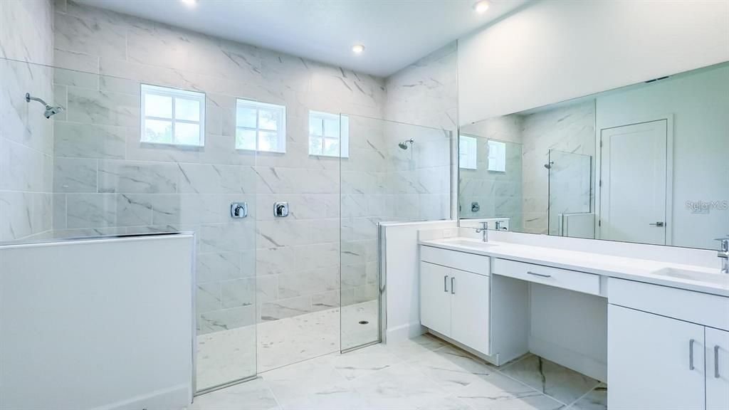 Bathroom, Dual Sink Vanities, Glass Shower, Interior, Marble, Marble Walls, Recessed Lighting