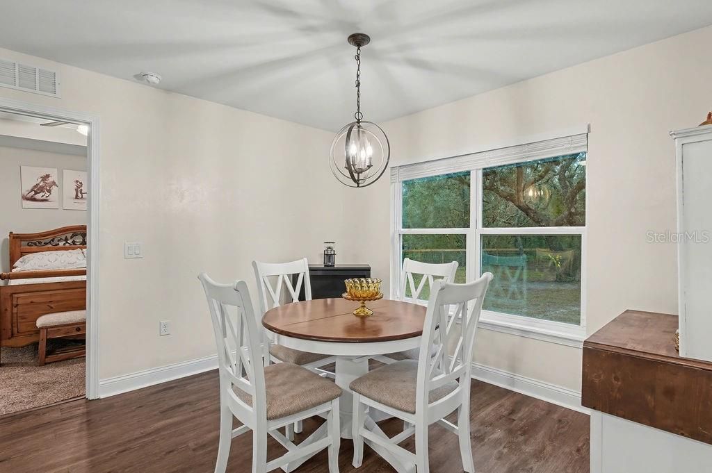 Dining room, Interior, Pendant Lights, Piano, Wood Texture Flooring