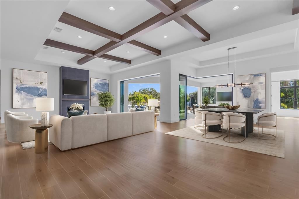 Dining room, Fireplace, Interior, Living room, Pendant Lights, Recessed Lighting, Wooden Beams, Wood Texture Flooring