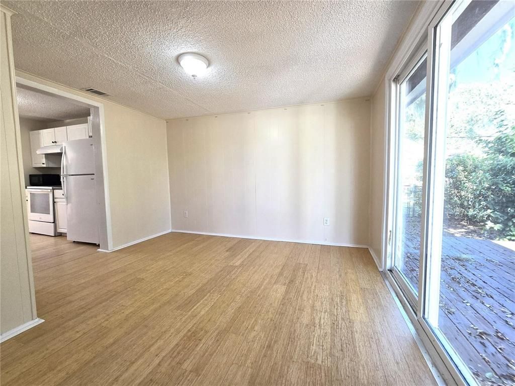 Empty room, Interior, Kitchen, Stainless Steel Appliances, Wood Texture Flooring