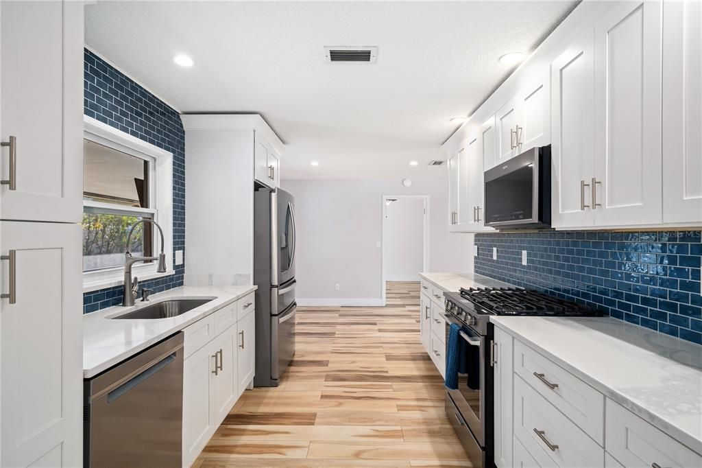 Interior, Kitchen, Recessed Lighting, Stainless Steel Appliances, Wood Texture Flooring