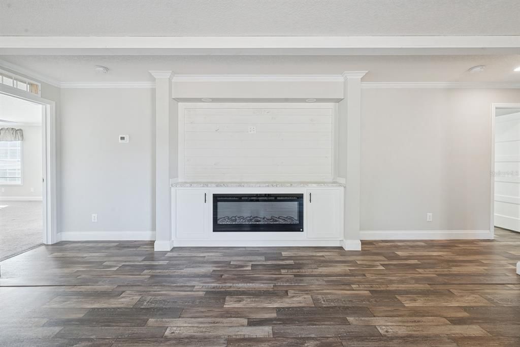 Empty room, Fireplace, Interior, Recessed Lighting, Wood Texture Flooring