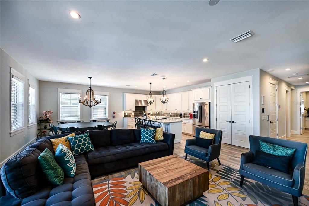 Chandelier, Dining room, Interior, Kitchen, Living room, Pendant Lights, Recessed Lighting, Stainless Steel Appliances, Wood Texture Flooring