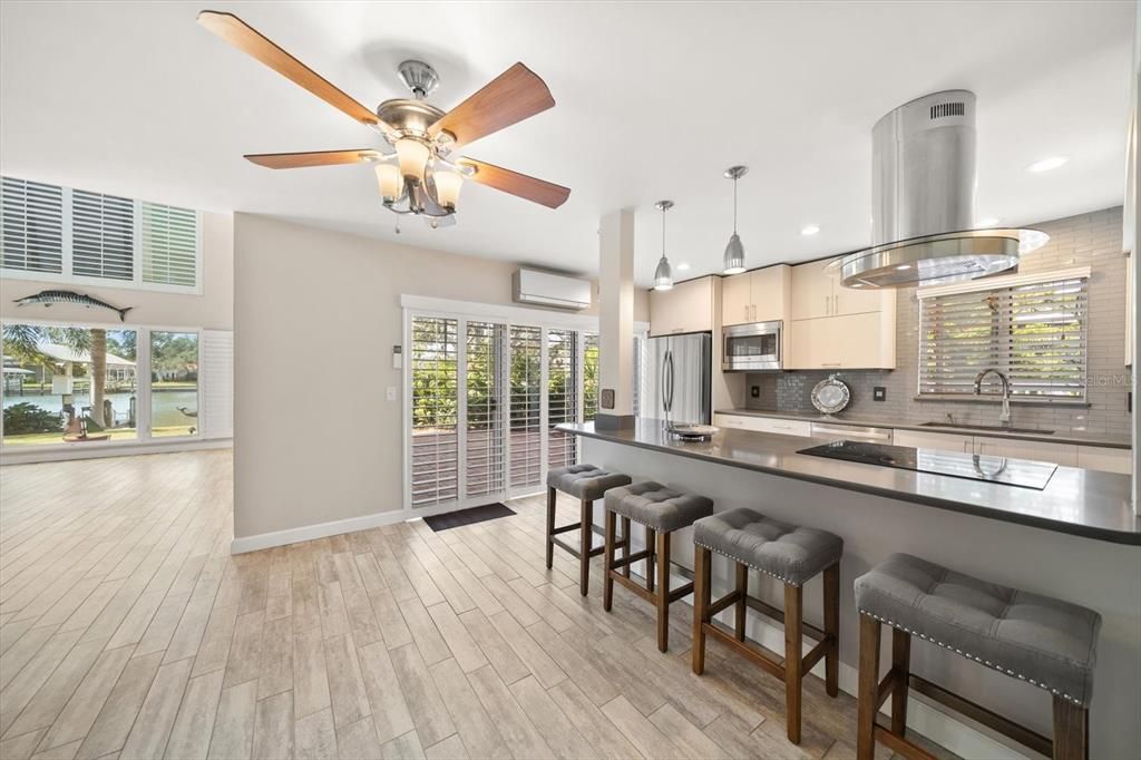 Interior, Kitchen, Pendant Lights, Recessed Lighting, Stainless Steel Appliances, Water, Wood Texture Flooring