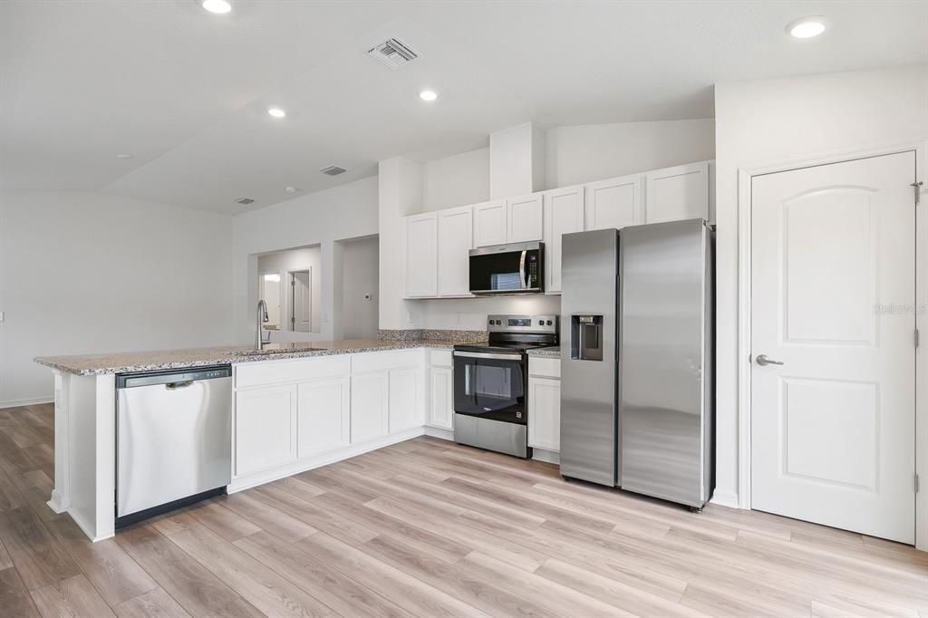 Interior, Kitchen, Recessed Lighting, Stainless Steel Appliances, Wood Texture Flooring